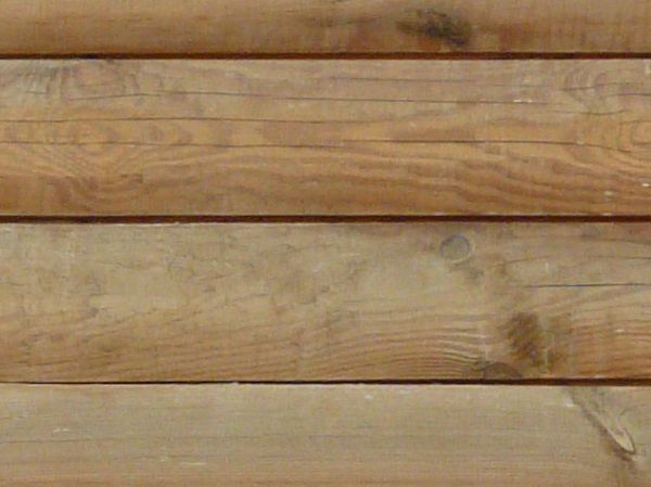 Light grey planks with rounded edges and natural dark spots.